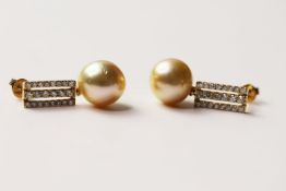 Pair Of Pearl & Diamond Earrings, set with 2 cultured south sea pearls, 44 round brilliant cut