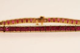 French Cut Ruby Line Bracelet, estimated total ruby weight 10.00ct, chanel set links, marked 14ct