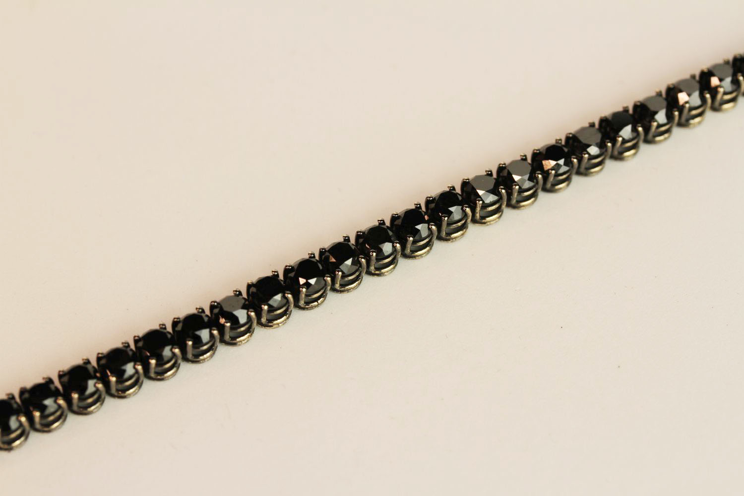 18ct white gold black diamond line bracelet, boxed. Black diamonds 14.38ct, approximate length 18.