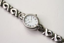 ROTARY WRISTWATCH W/BOX, oval white dial with roman numerals, 18mm sterling silver case with snap