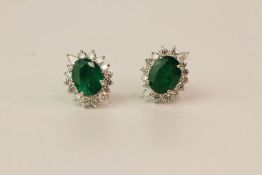 Pair Of Emerald & Diamond Earrings, set with round brilliant diamonds