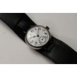 SILVER CASED TRENCH WATCH, white dial with red twelve hour markers, Arabic numerals, manual wind,