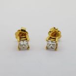 Unmarked yellow gold Princess cut diamond earrings. Approximately 1 carat in total. Earring