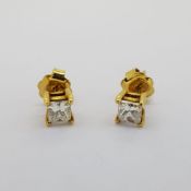 Unmarked yellow gold Princess cut diamond earrings. Approximately 1 carat in total. Earring