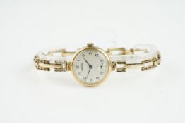 LADIES VERTEX 9CT GOLD WRISTWATCH, circular silver dial with hour markers and hands, 24mm case
