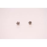 Pair of platinum 6-claw set 0.30ct RBC diamond solitaire studs with platinum and rubber butterflies,