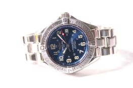 BREITLING SUPEROCEAN WRIST WATCH WITH BREITLING CASE circular sunburst blue dial with arabic numeral