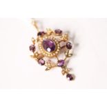 Amethyst & Seed Pearl Brooch/Pendant, set with a central oval cut amethyst, surrounded by seed
