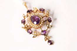 Amethyst & Seed Pearl Brooch/Pendant, set with a central oval cut amethyst, surrounded by seed