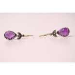 Pair of silver and 9ct yellow gold drop earrings set with pear-shaped cabochon amethysts and