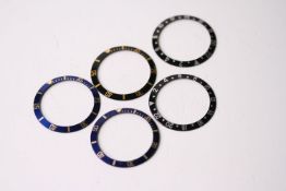 5x ROLEX BEZEL INSERTS, INCLUDING GMT AND BI-COLOUR SUBMARINERS, group of 5 Rolex bezel inserts,