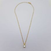 Approximate 1 carat princess cut diamond in a yellow gold pendant on an 18 carat yellow gold chain