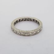 9 carat white gold vintage diamond eternity ring with engraved pattern sides. Marked 9CT