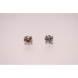 Pair of 18ct white gold 4-claw round brilliant cut solitaire diamond studs, boxed. Diamonds 1.57ct