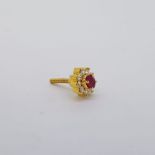Yellow gold single diamond and ruby earring with screw post. marked 18/0.42 on the reverse. Approx