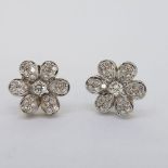 Tested 18 carat white gold large daisy shaped diamond set earrings. Diamond weight approximately1.50