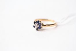 Sapphire & Diamond Flower Ring, stamped 18ct yellow gold, size K, 2.65g.