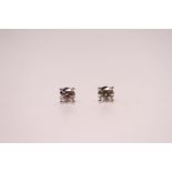 Fine quality pair of 18ct white gold 4-claw set solitaire diamond studs, boxed. RBC diamonds 1.01ct