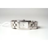 BAUME & MERCIER WRISTWATCH, rectangular white dial with dot hour markers and arabic numbers 3, 9 and