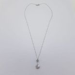 White gold diamond pendant suspended on a marked 18 carat 40cm white gold chain. Diamond content