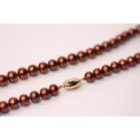 String of coco freshwater cultured pearls with a 9ct yellow gold ball coffee bean clasp