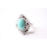 Turquoise Ballerina Cocktail Ring, centre set with a cabochon cut turquoise, claw set, surrounded by