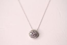 10ct white gold diamond cluster pendant with a 10ct white gold Prince Of Wales style-chain, boxed.