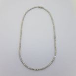 53 round brilliant diamonds make up this 18 carat white gold necklace. Approximate total weight 10