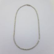 53 round brilliant diamonds make up this 18 carat white gold necklace. Approximate total weight 10