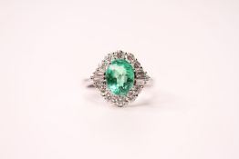18ct white gold oval emerald and diamond cluster ring. Emerald 2.01ct. Diamonds 0.78ct (round-cut