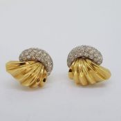 c1950 pave set diamond earrings with a yellow gold fan. The fan shell is marked 14CT, Approximate