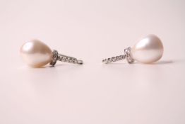 Pair of large 18ct white gold pear-shaped pearl and diamond earrings, boxed. Round-cut diamonds 0.