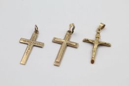 3 x 9ct gold crucifix and cross pendants 2.8 grams gross