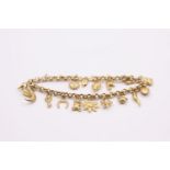 9ct gold charm bracelet with 15 charms 8.3 grams gross