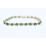 9ct gold Green gemstone line bracelet 9.5 grams gross