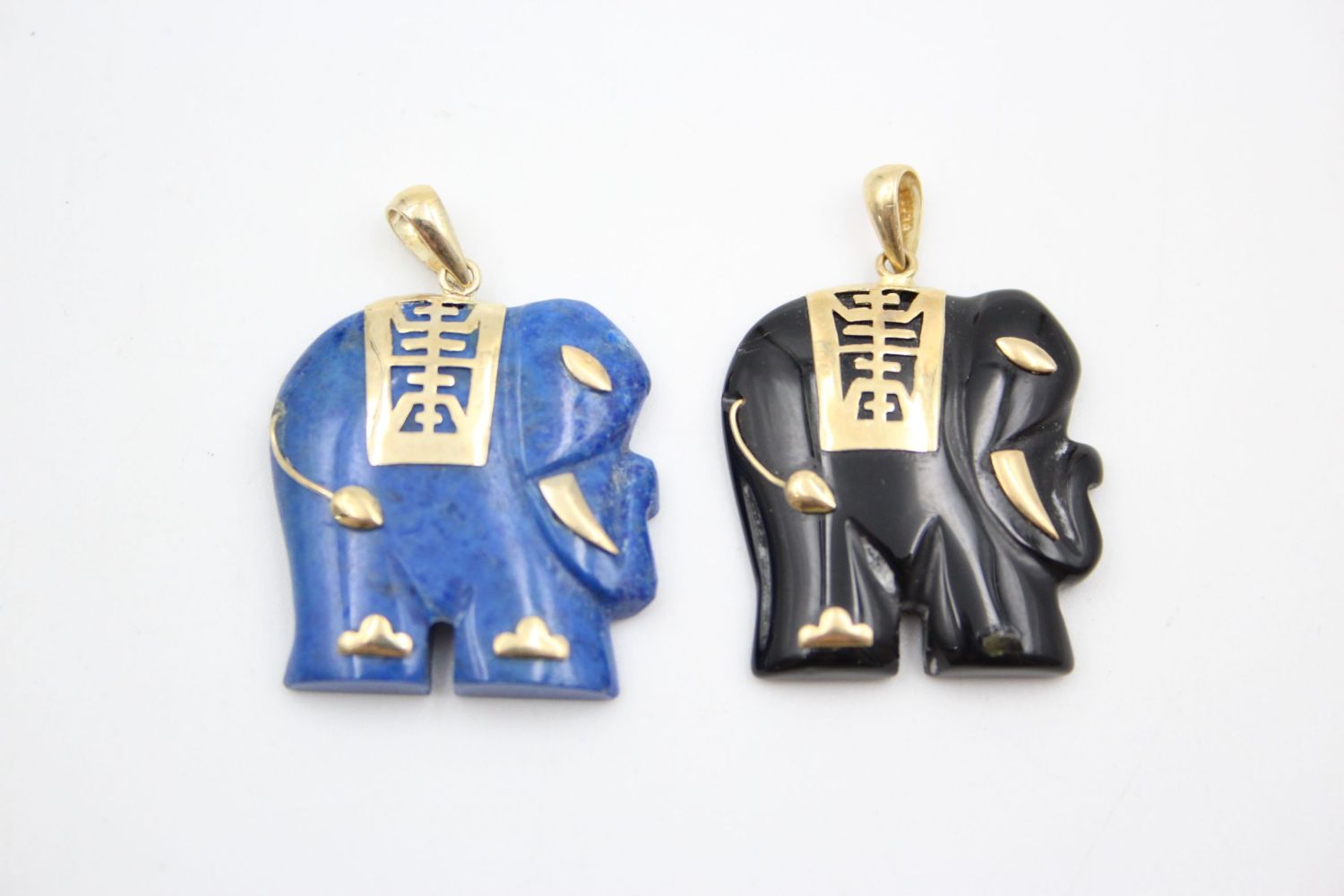 2 x 9ct gold oriental elephant gemstone pendants inc. lapis, onyx 11 grams gross