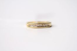 Channel Cut Diamond Ring, set with round brilliant cut diamonds, 18ct yellow gold, size M, 2.4.g