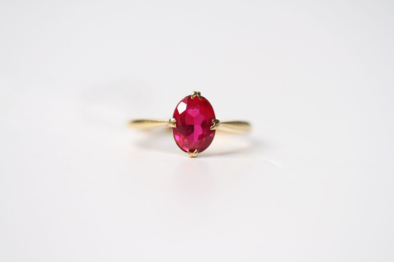 Ruby Solitaire Ring, oval cut ruby, claw set, stamped 18ct yellow gold, size O, 2.7g.