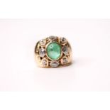 Emerald & Diamond Ring, set with a central cabochon cut emerald, surrounded by diamonds, french