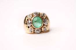 Emerald & Diamond Ring, set with a central cabochon cut emerald, surrounded by diamonds, french