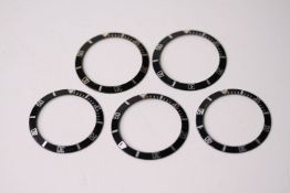 5x ROLEX SUBMARINER 16610 BLACK BEZEL INSERTS, group of 5 16610 Rolex Submariner bezel inserts,