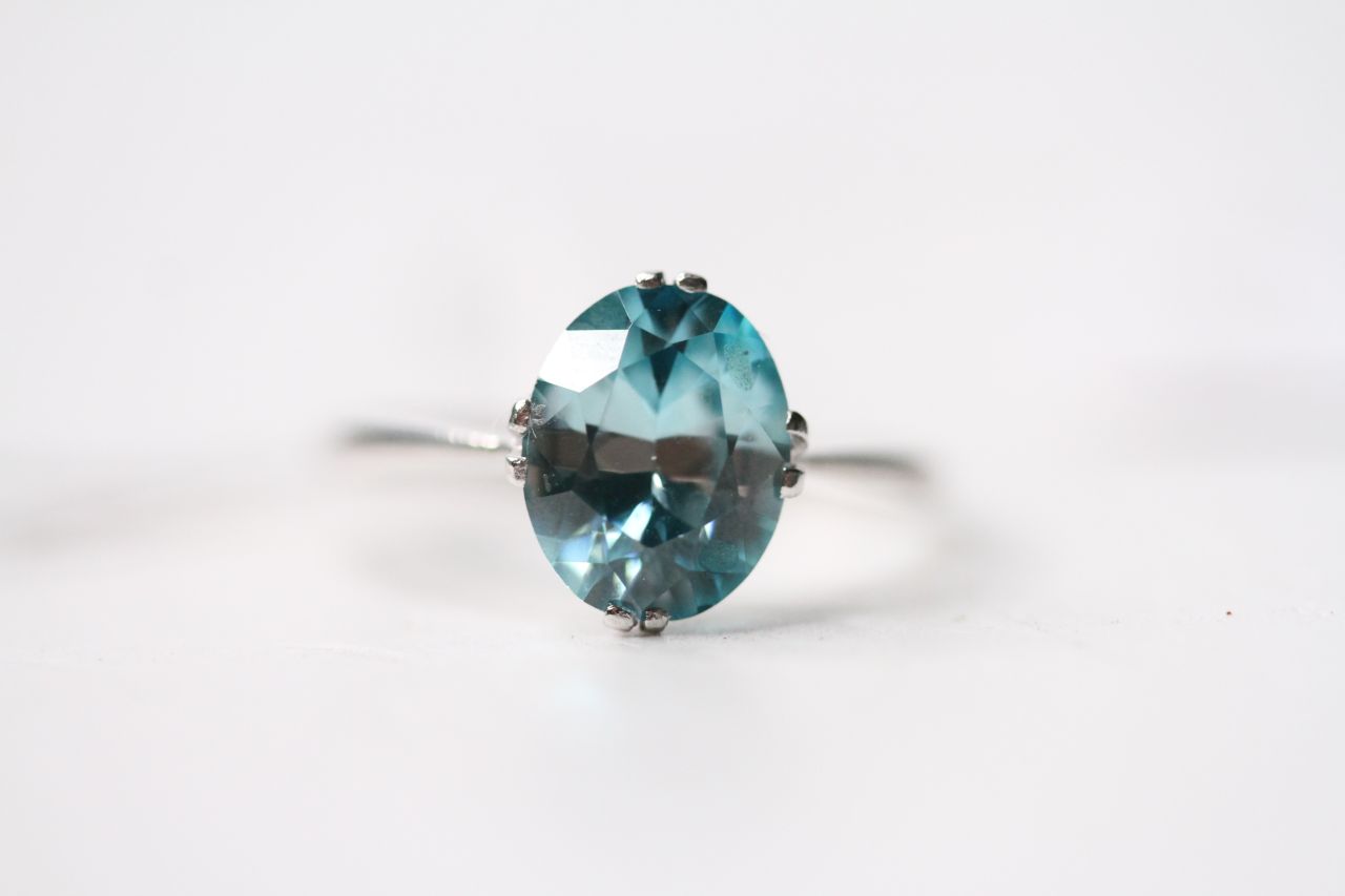 Blue Zircon Solitaire Ring, set with an oval cut blue zircon, claw set, size P, 18ct white gold,