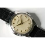 MOVADO AUTOMATIC BUMPER MOVEMENT WRIST WATCH, circular cream dial with baton and arabic numersl hour