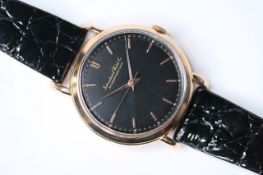 VINTAGE 18CT IWC WRIST WATCH 1956, circular black dial with gold baton hour markers, 36mm 18ct