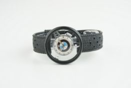 GENTLEMENS BMW NOVELTY WHEEL WRISTWATCH, circular BMW badge dial with block hour markers and