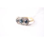 Sapphire & Cluster Ring, stamped 18ct yellow gold, size R, 4.37g.