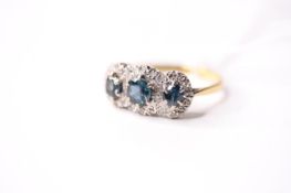 Sapphire & Cluster Ring, stamped 18ct yellow gold, size R, 4.37g.