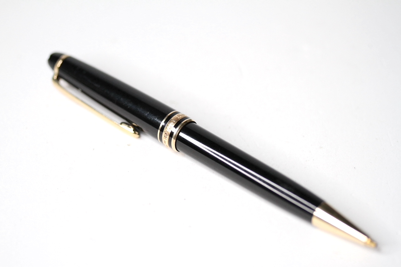 MONTBLANC MEISTERSTUCK PENCIL, black case with yellow gold accents, pencil led in tact and the