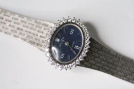 LADIES 18CT ROLEX PRECISION DIAMOND BEZEL CIRCA 1960s, oval blue dial with baton and roman numeral