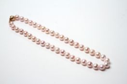 Necklace strung with pinkish white cultured pearls with a 9ct yellow gold ball clasp